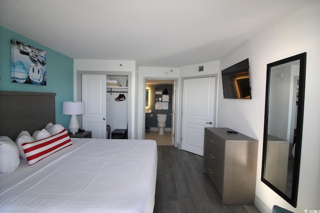 bedroom with connected bathroom, a closet, and dark hardwood / wood-style flooring