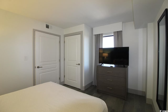 bedroom featuring dark hardwood / wood-style floors