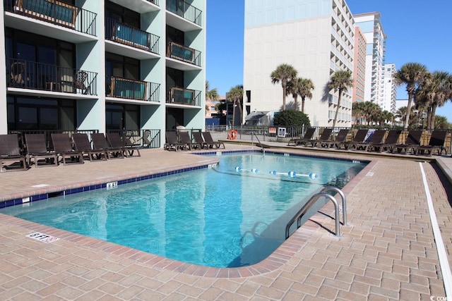 view of swimming pool featuring a patio