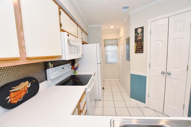 kitchen with white appliances, light tile patterned floors, ornamental molding, white cabinetry, and electric panel