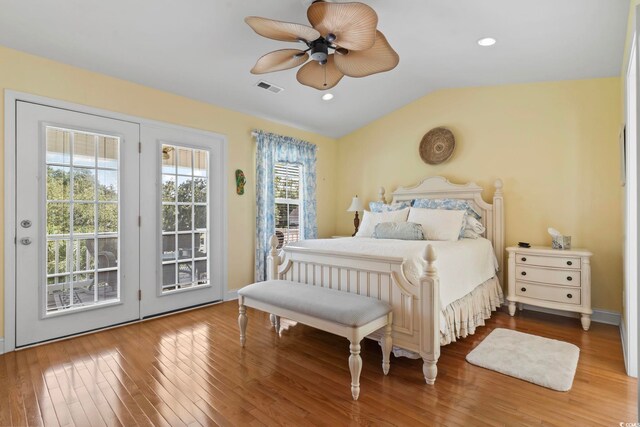 bedroom with ceiling fan, wood-type flooring, access to outside, and vaulted ceiling