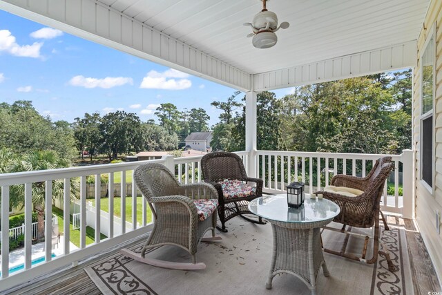 exterior space featuring ceiling fan