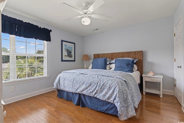 bedroom featuring hardwood / wood-style flooring and ceiling fan