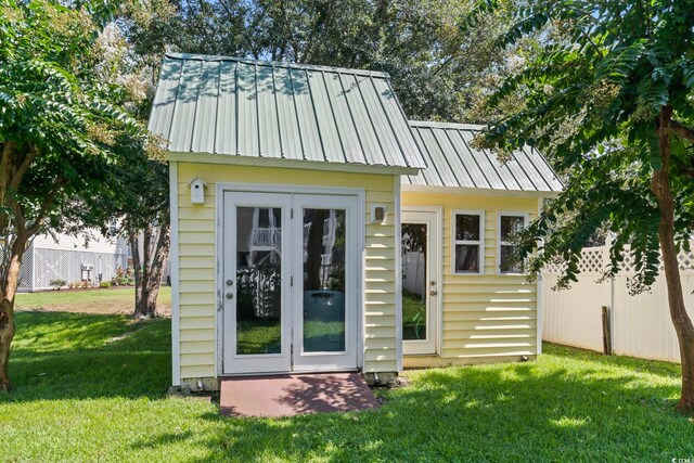 view of outdoor structure with a yard