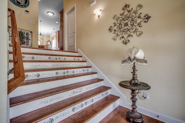 stairs with wood-type flooring