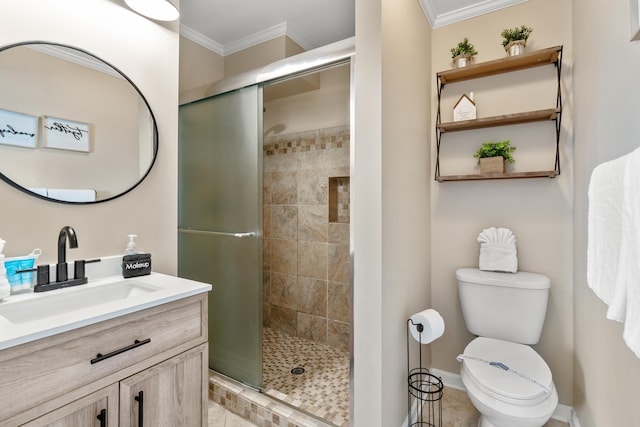 bathroom featuring a stall shower, crown molding, vanity, and toilet