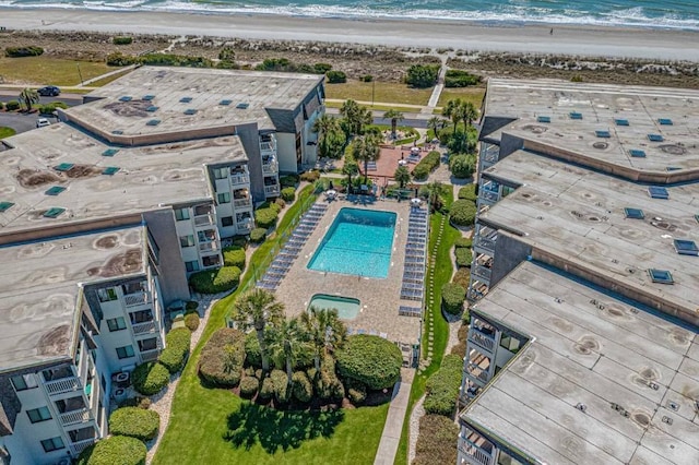 aerial view with a view of the beach and a water view