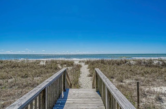 view of property's community featuring a view of the beach and a water view