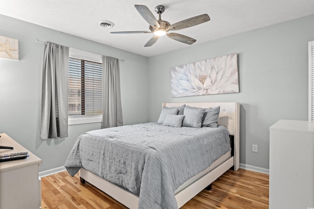 bedroom with light wood-type flooring and ceiling fan