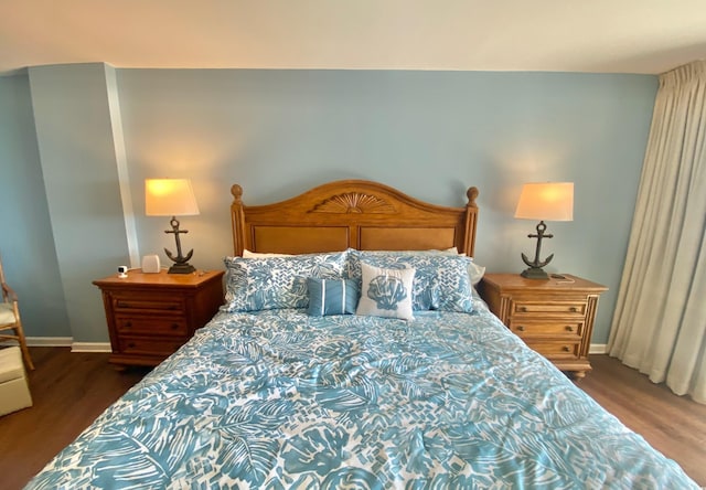 bedroom featuring dark wood-type flooring