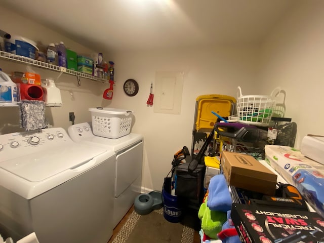 laundry area with washing machine and dryer and electric panel