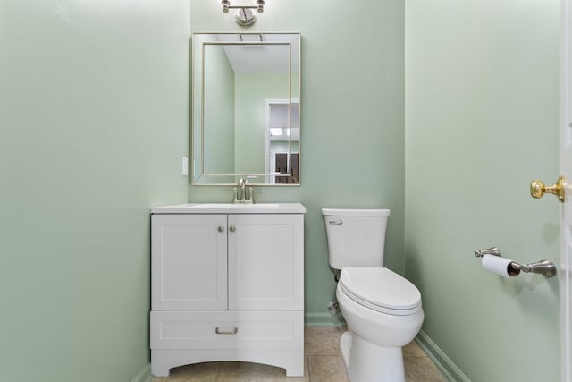 bathroom featuring vanity, toilet, and tile patterned floors