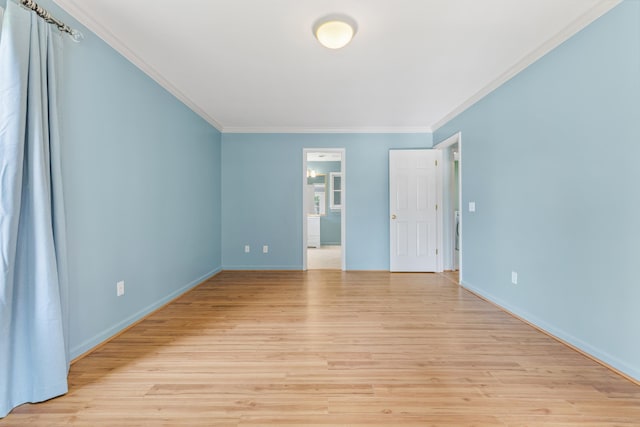 unfurnished room with ornamental molding and light hardwood / wood-style floors