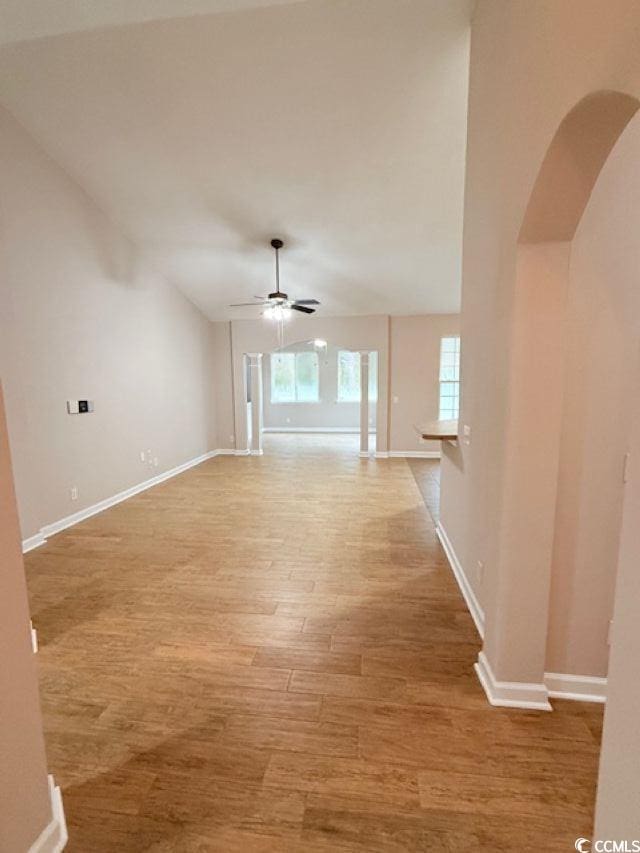 interior space featuring lofted ceiling and light hardwood / wood-style floors