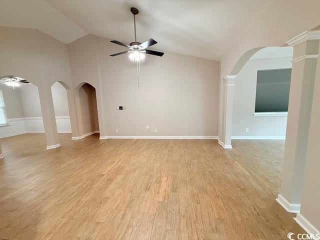 unfurnished living room featuring ceiling fan, high vaulted ceiling, and light wood-type flooring