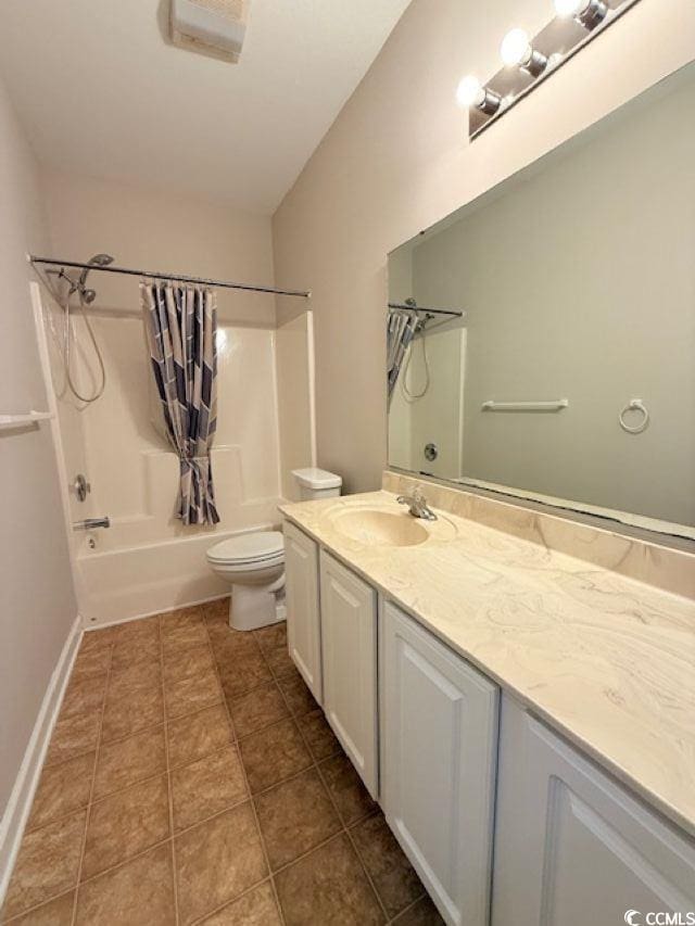 full bathroom with tile patterned flooring, shower / bath combo, vanity, and toilet