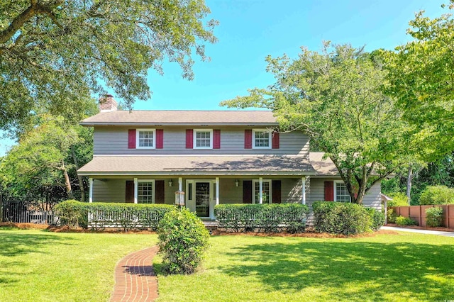 view of front facade with a porch and a front lawn