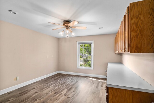 interior space featuring hardwood / wood-style flooring and ceiling fan