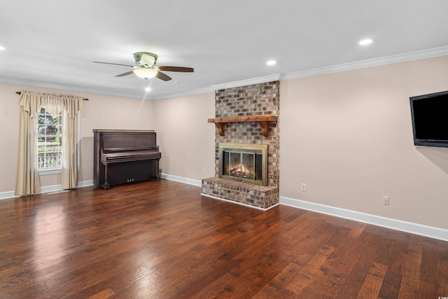 unfurnished living room with crown molding, a brick fireplace, and dark hardwood / wood-style floors