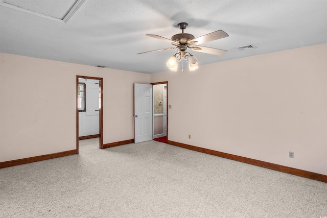 unfurnished room with a textured ceiling and ceiling fan