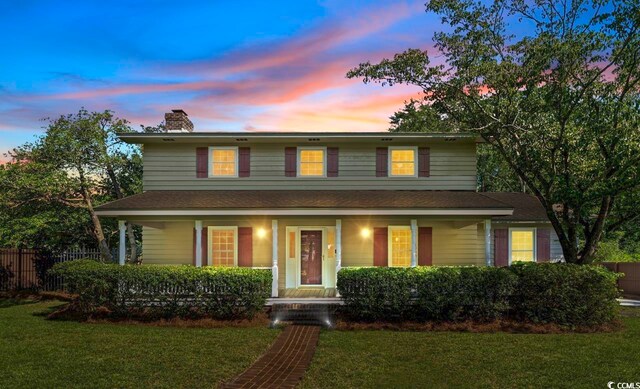 view of front of home with a lawn