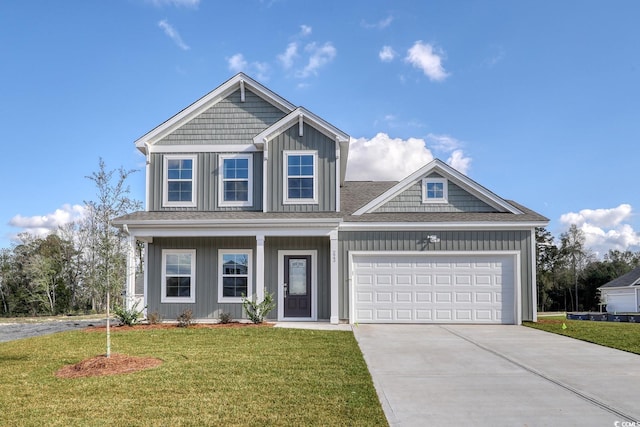 view of front of house with a garage and a front yard