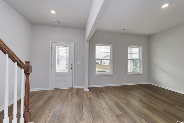 foyer featuring a wealth of natural light and light wood-type flooring