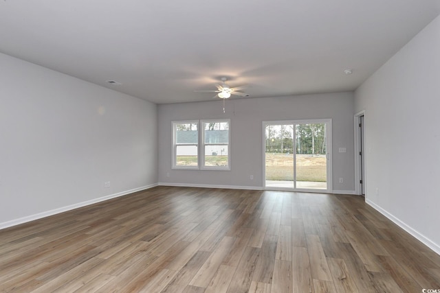 unfurnished room featuring ceiling fan and hardwood / wood-style flooring