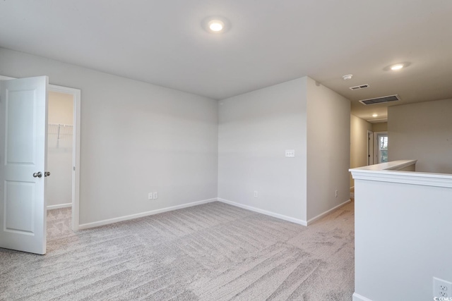 empty room with light colored carpet