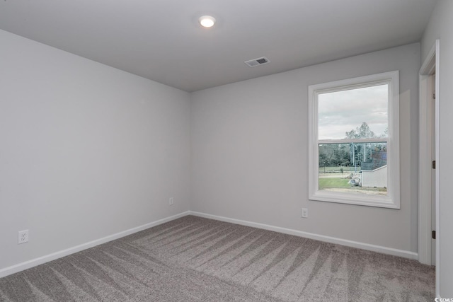 unfurnished room featuring carpet flooring