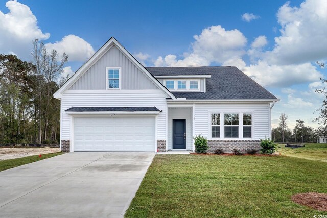 view of front facade with a front lawn and a garage