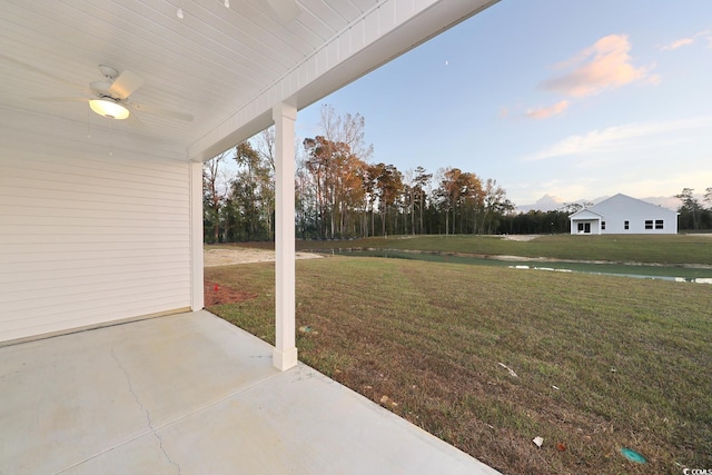 view of yard featuring ceiling fan