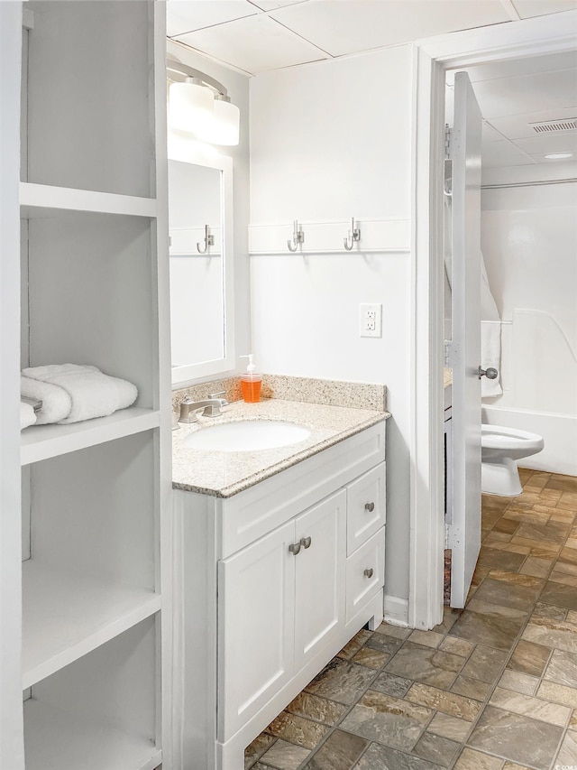 full bathroom featuring toilet, shower / bathing tub combination, and vanity