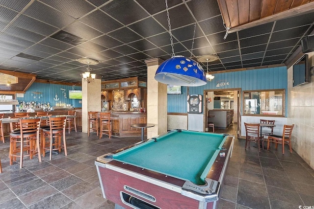 playroom featuring pool table, bar, and a drop ceiling