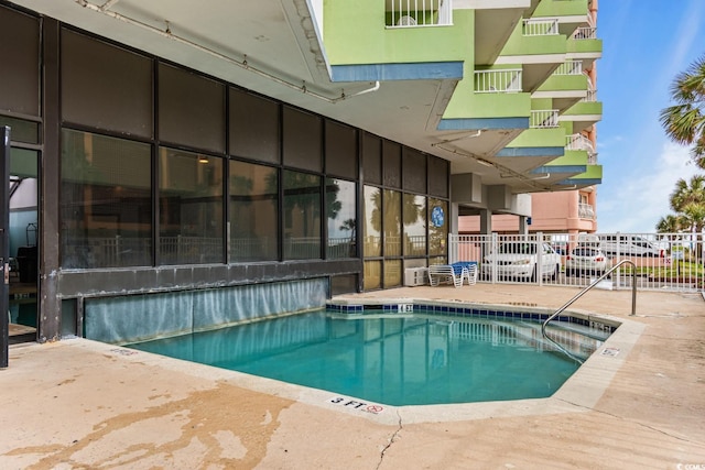 view of pool featuring a patio area