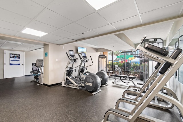 exercise room with a drop ceiling