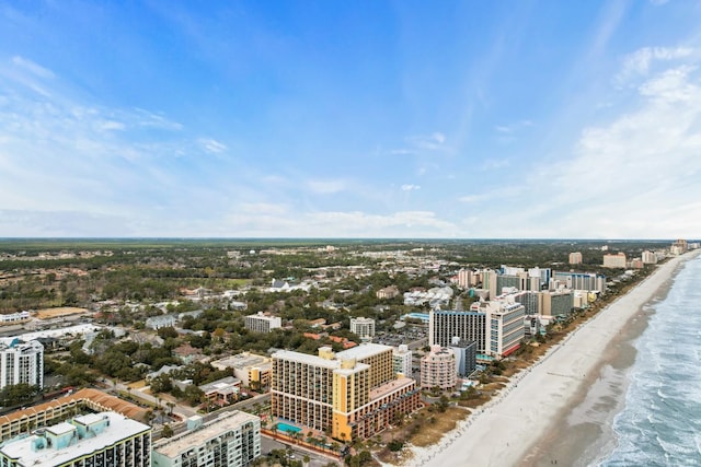 bird's eye view featuring a water view and a beach view