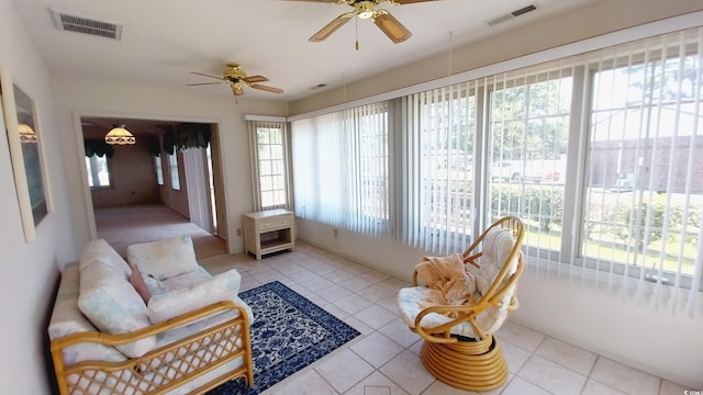 sunroom / solarium with ceiling fan and a wealth of natural light