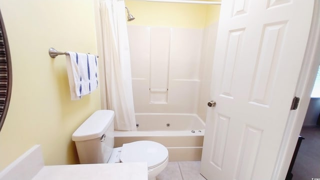 bathroom with tile patterned flooring, shower / bath combination with curtain, and toilet