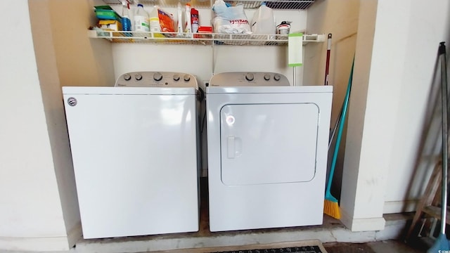 washroom featuring washer and clothes dryer