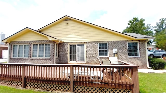 back of property featuring a deck