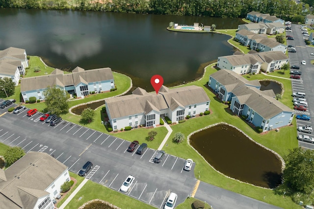 birds eye view of property featuring a residential view and a water view