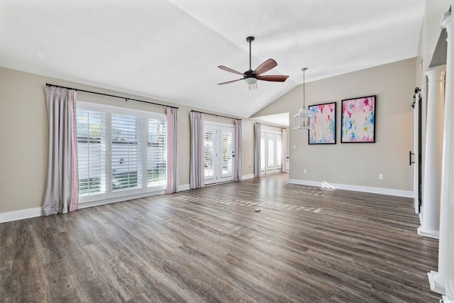 unfurnished living room with a textured ceiling, ceiling fan, lofted ceiling, and dark hardwood / wood-style floors