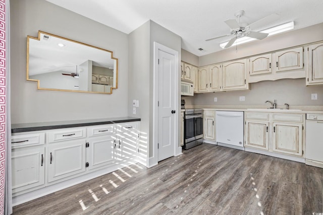 kitchen with ceiling fan, wood-type flooring, sink, and white appliances