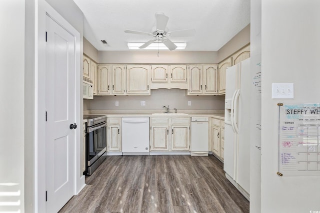 kitchen featuring ceiling fan, dark hardwood / wood-style floors, sink, white appliances, and a textured ceiling