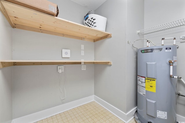 utility room featuring water heater