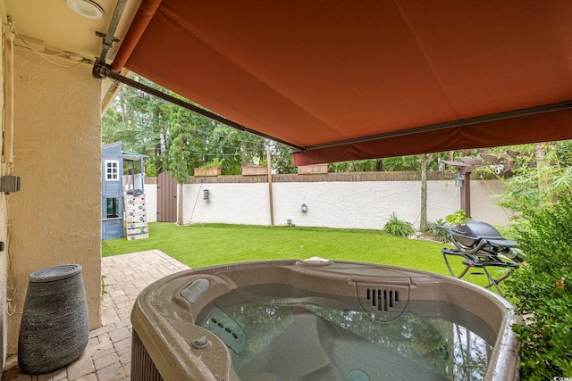 view of patio with a hot tub