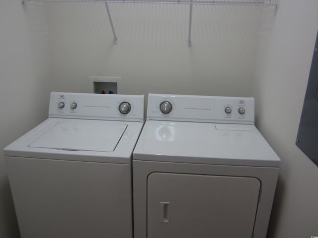 laundry room with laundry area and washer and clothes dryer