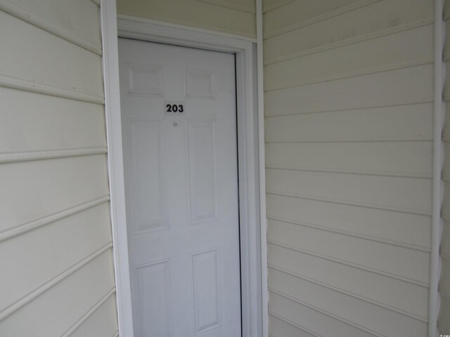 property entrance with a garage