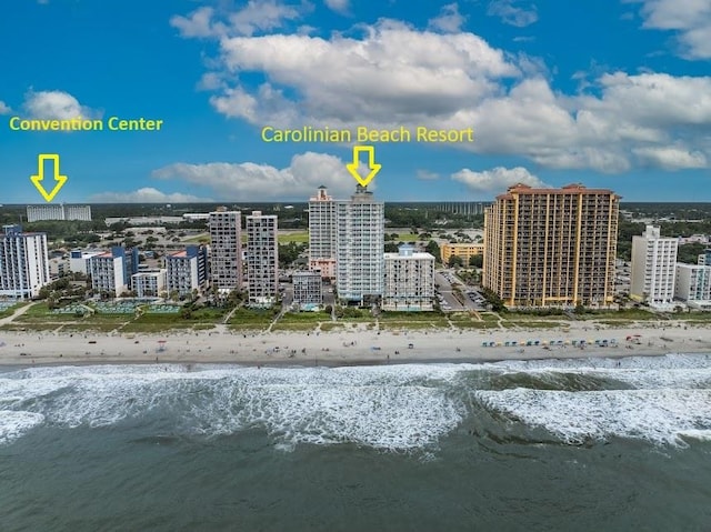 bird's eye view featuring a view of the beach and a water view